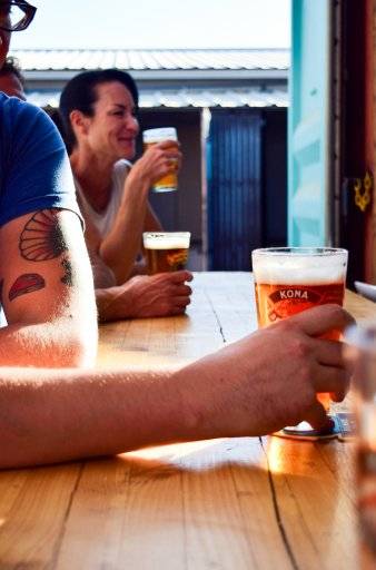 people sitting outside with beer