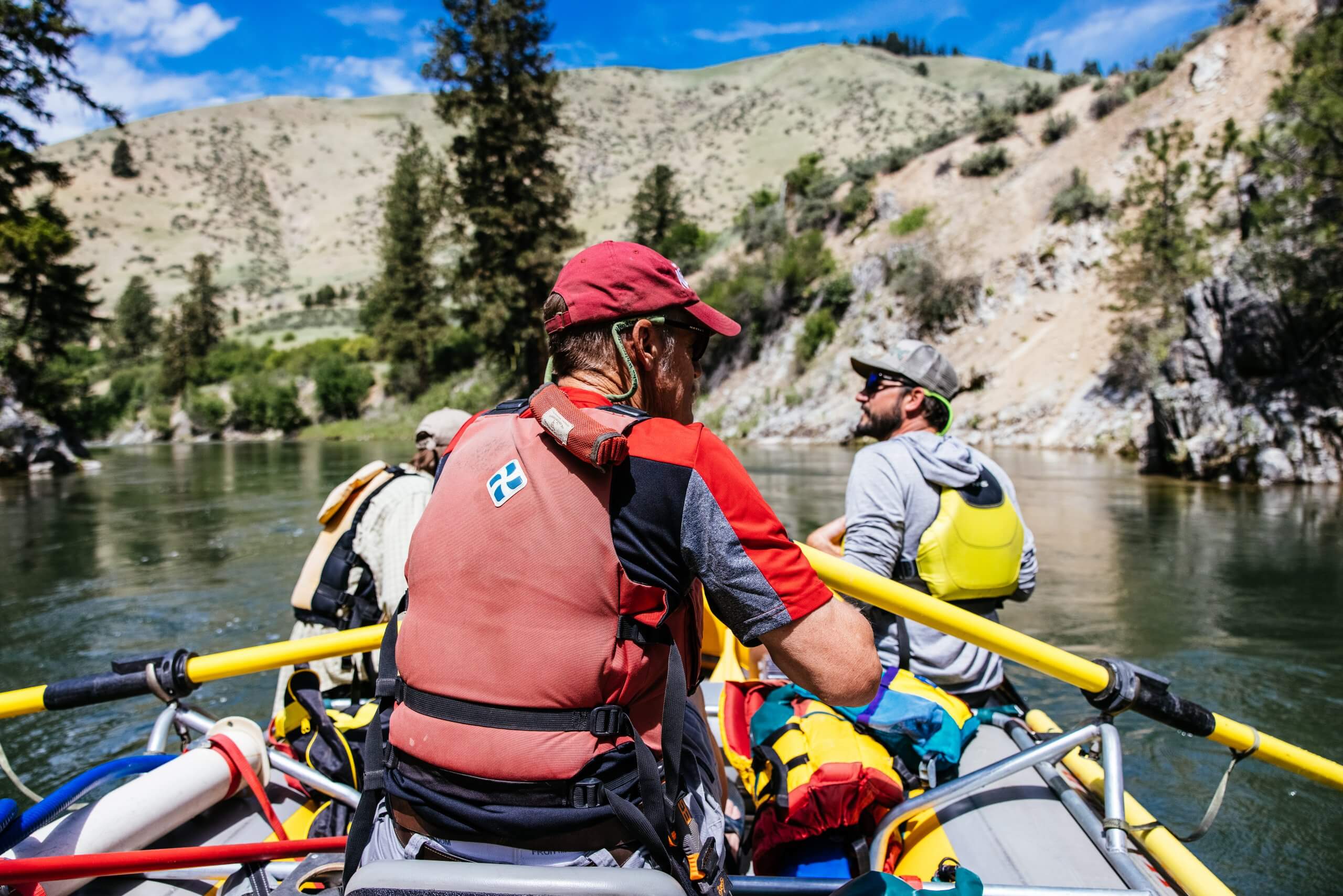 people in whitewater raft on a river