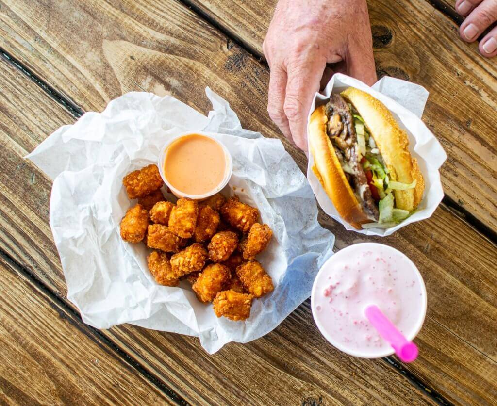 cheeseburger, strawberry milkshake and tater tots