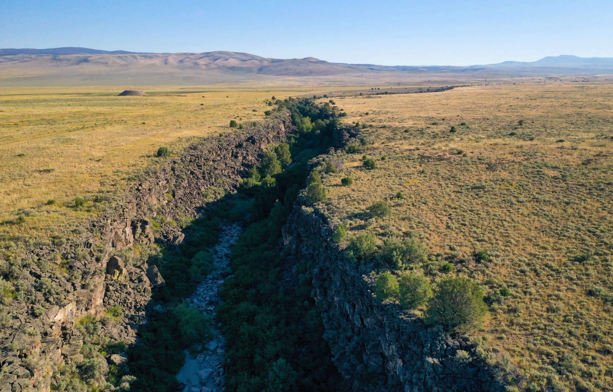 Aerial view of Beaver Canyon, surrounded by an open landscape.