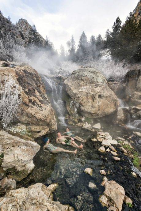 people in natural hot pool