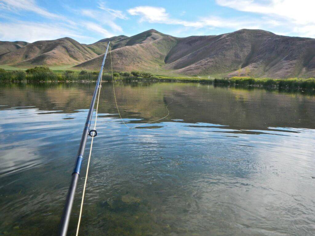 A fishing rod positioned over the Silver Creek.