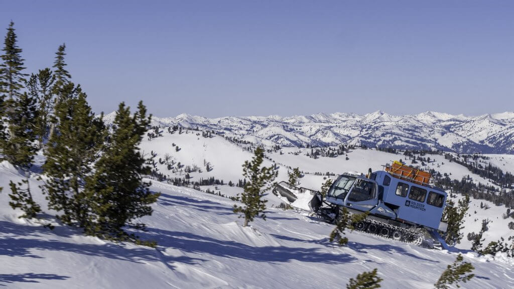 A snowplow leveling out a ski run on Soldier Mountain Ski Area.