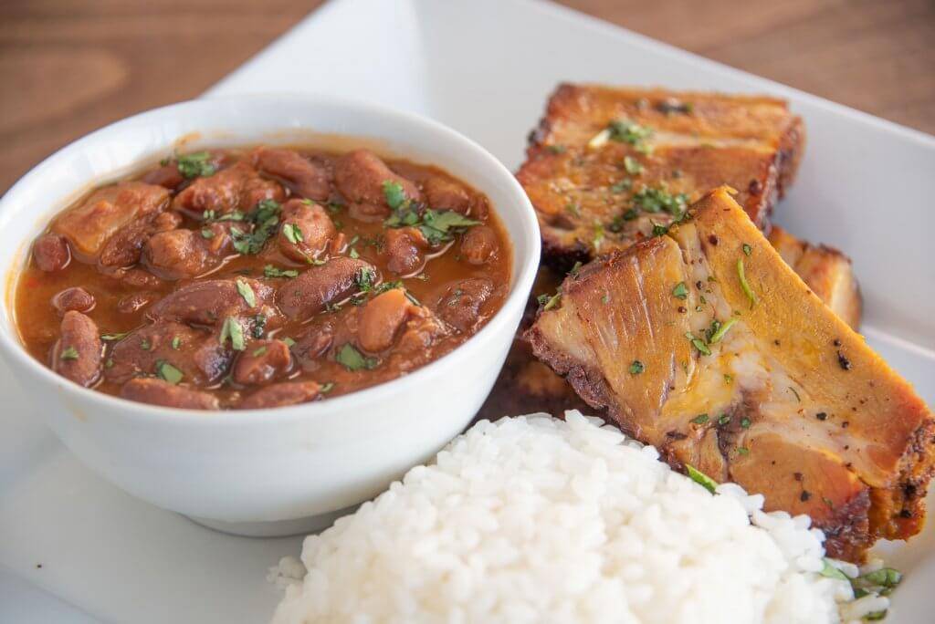 Puerto Rican flavors in Wepa! Café’s pernil with rice and beans